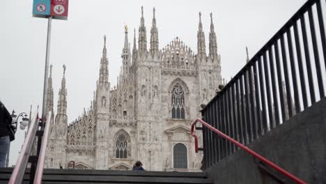Static-view-of-Duomo-of-Milan-from-exit-of-metro-station-with-people-in-front