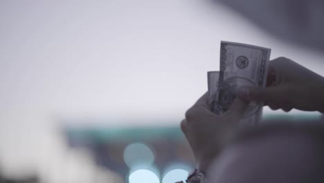 Make-it-rain-in-the-sky-while-flipping-the-money-note-perfectly-in-slow-motion