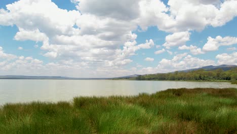 Low-level-flying-drone-shot-over-lake-elemetaita