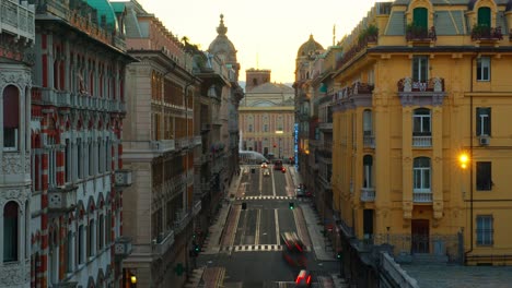 Sunset-timelapse-of-a-bustling-Genoa-street-with-flowing-traffic-and-historic-architecture