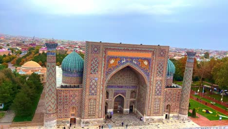 Aerial-cityscape-The-Registan-Square-is-the-best-place-to-discover-the-old-Uzbek-architecture-and-to-enjoy-the-great-mosaic-decorations,-Samarkand
