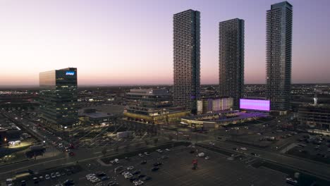 Aerial-view-of-Sun-setting-at-Vaughan-Metropolitan-Centre-Transit-Hub,-KPMG-PWC-YMCA-TTC-Transit-City-Bus-Terminal