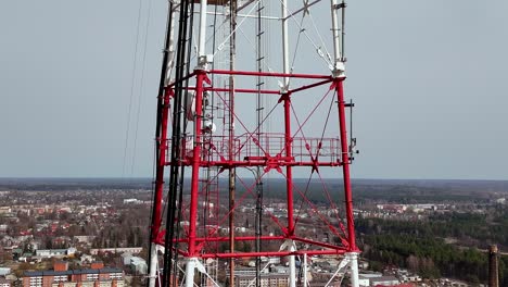 Aerial-Drone-Closeup-at-white-red-Tower-communication-service-in-Valmiera-Latvia