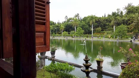 Religious-Palace-Taman-Ujung-Palace-Bali-Travel-Tourism-Destination-with-Lake-and-Pond-View-as-an-attraction-with-view-from-brown-windows