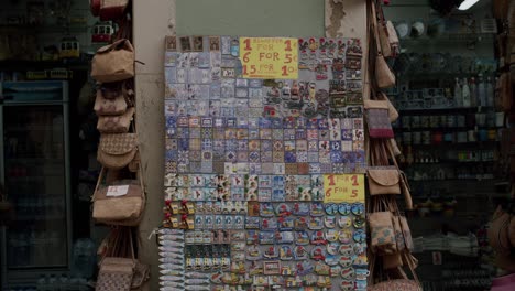 Roadside-souvenir-shop-with-magnets,-keramic-in-Lisbon,-Portugal