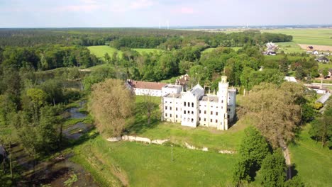 Dobra-Castle-Surrounded-By-Lush-Nature-Park-In-Dobra,-Opole-Voivodeship,-Poland