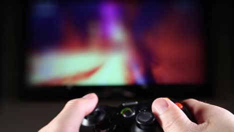 POV---point-of-view-of-hands-with-video-game-controller-playing-a-racing-game