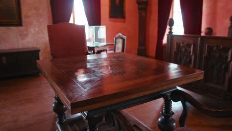 Intricately-carved-wooden-table-in-Baroque-Room-at-Trakošćan-Castle,-Croatia