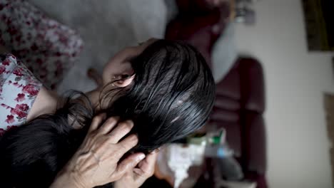 View-Of-Back-Head-Of-Female-Getting-Oil-Massaged-Into-Her-Hair-And-Scalp