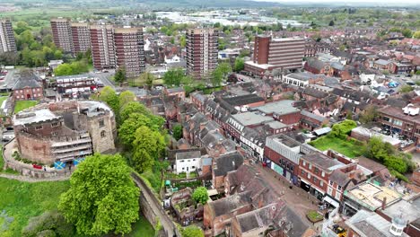 Tamworth-castle-Staffordshire,-high-rise-tower-blocks-in-background-UK-drone,aerial