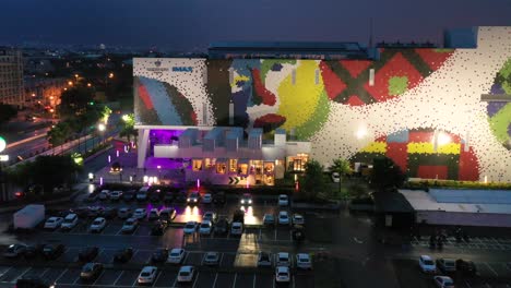 Aerial-pan-shot-overlooking-new-paradiso-shopping-mall-starbucks-container-coffeehouse-at-Hualien-city,-Taiwan