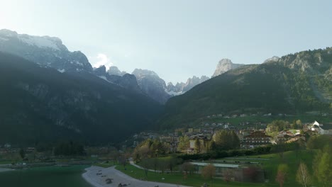 Aerial-view-of-Molveno-town-and-mountains-of-Dolomites-region,-Italy