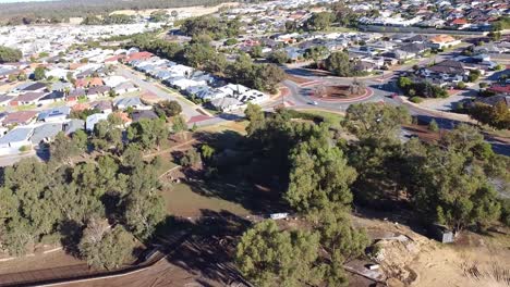 Aerial-reverse-view-over-flood-damage-to-Riverlinks-Park-playground-development,-Clarkson-Perth