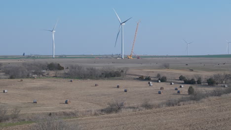 Oklahoma---Aerial-Boom-down-on-farmland-with-Wind-Turbine-and-crane-repairing