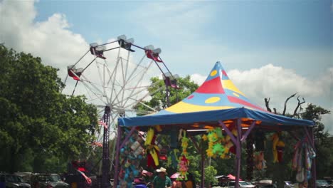 Wide-view-of-a-carnival-with-a-blue-sky-in-the-background