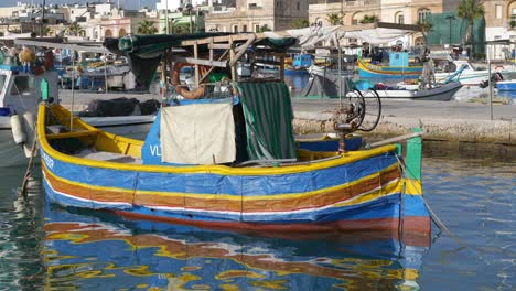 Marsaxlokk,-Malta---October-14,-2019:-Traditional-Maltese-painted-fishing-boat-called-Luzzu-in-Marsaxlokk-fishing-village-in-Malta-island-in-the-Mediterranean-Sea