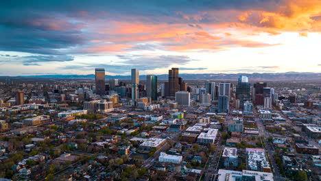 Sunset-aerial-hyperlapse-of-Denver-city-traffic-flow-in-streets-and-vibrant-sky