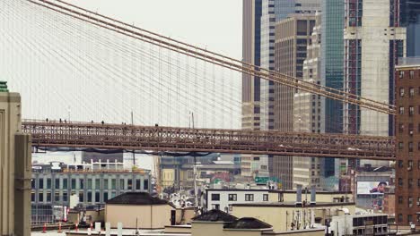 Close-up-of-Brooklyn-Bridge-with-people