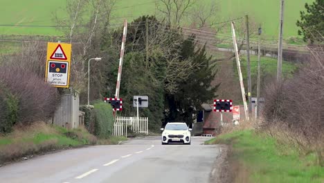 A-railway-crossing-on-a-rural-road-in-the-village-of-North-Luffenham-in-the-county-of-Rutland,-England