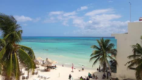 Drone-shot-from-the-beach-coast-towards-the-horizon-of-the-turquoise-sea