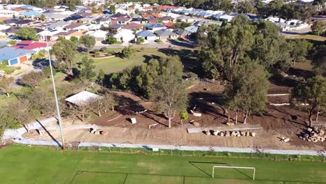 Aerial-dolly-right-clip-of-playground-construction-works-after-flooding,-riverlinks-Park-Clarkson-Perth