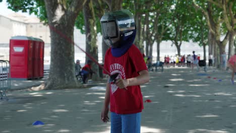 Slow-motion-shot-of-a-young-boy-swinging-his-sword-in-fencing-gear