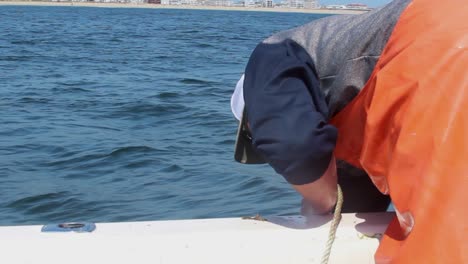 Young-Lobsterman-pulls-in-trap-from-atlantic-ocean