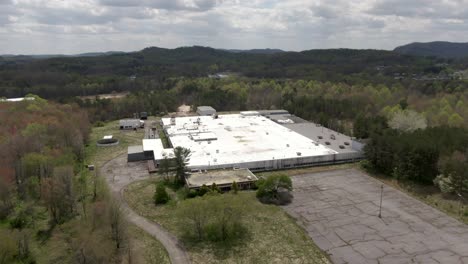 Aerial-Drone-Footage-Orbiting-left-Around-an-Abandoned-National-Standard-Factory