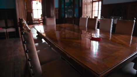 Close-up-of-a-grand-dining-table-with-ornate-chairs-in-the-historical-dining-room-of-Trakošćan-Castle,-Croatia