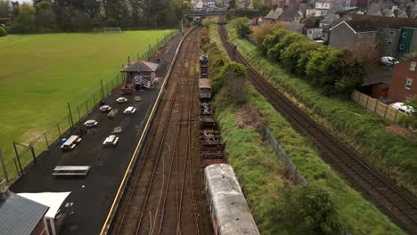 Aerial-of-a-vintage-railway-station-in-Whitehead,-Northern-Ireland