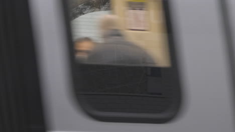 paris,France---December,31th-2020-:a-train-arriving-at-the-station-masking-the-"Bonne-Nouvelle"witch-means-"Good-news"-metro-station-sign-hijacked