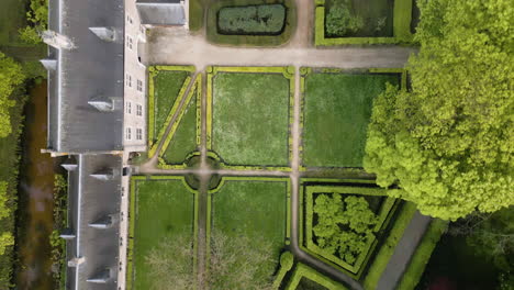 Beautiful-monastery-building-complex-and-green-yard-in-Belgium,-aerial-top-down-view