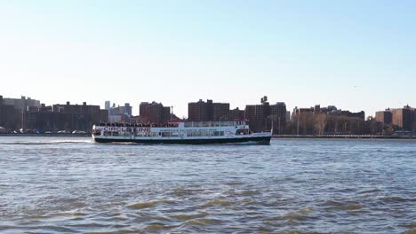 Pan-right-view-of-a-tourist-boat-traveling-north-on-East-River