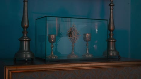 Religious-artifacts-in-a-glass-display-case-in-the-Prayer-Room-of-Trakošćan-Castle-,-Croatia