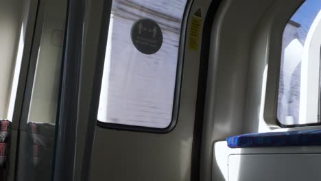 View-Of-Looking-Out-Of-Jubilee-Train-Door-As-It-Approaches-Station-Platform