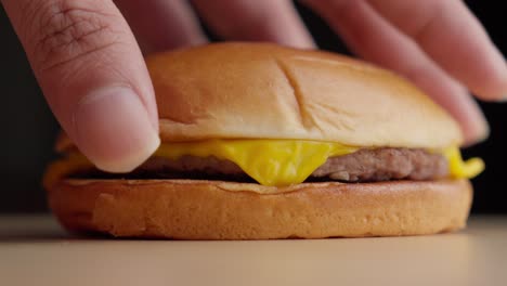 Closeup-shot-at-mc-Donald's-style-Cheese-burger-being-prepared-at-kitchen