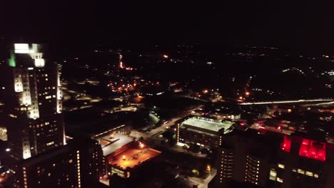 Nighttime-downtown-Raleigh-North-Carolina-skyline-drone-pan-left