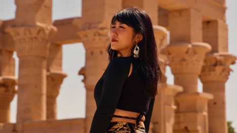 Beautiful-asian-woman-posing-infront-of-Trajan's-Kiosk-of-the-Philae-Temple