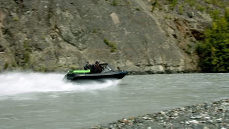 Speedboats-in-Glacial-River-in-a-Wilderness-of-Alaska-USA,-Slow-Motion-Tracking-Shot