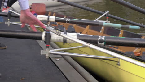 Men-preparing-Rowing-Boat-in-Water-in-Slow-Motion
