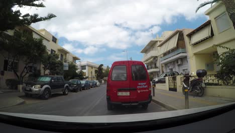 Driving-through-township-of-Rethymno-in-Crete-island,-POV-time-lapse