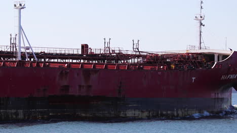 Hafnia-Lise-Oil-Tanker-Sailing-across-frame-of-camera,-to-reveal-Boston-in-the-background