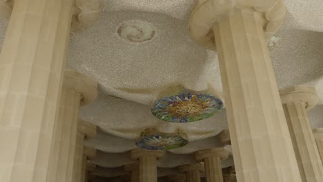 Scenic-ceiling-with-arches-and-mosaic-in-architectural-building-of-Parc-Güell-in-Barcelona