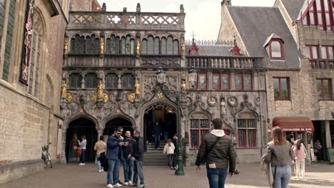 People-At-The-Entrance-Of-Basilica-of-the-Holy-Blood-In-Bruges,-Belgium