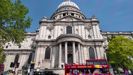 Looking-Up-At-St-Paul's-Cathedral-With-Sightseeing-Bus-Stuck-In-Traffic-Along-St