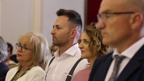 People-attentively-watch-a-ceremony-in-Zaragoza,-Spain