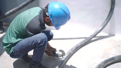 Profile-view-of-workers-cutting-thick-wires