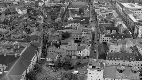 Black-and-white-time-lapse-of-bustling-Galway-City,-capturing-the-dynamic-energy-and-movement-of-urban-life