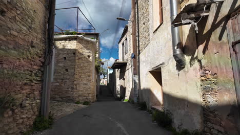Narrow-alleyway-with-old-stone-buildings,-Lefkara