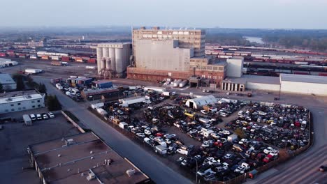 Aerial-drone-shot-of-the-wrecked-car-yards-in-the-industrial-area-of-Calgary,-Alberta